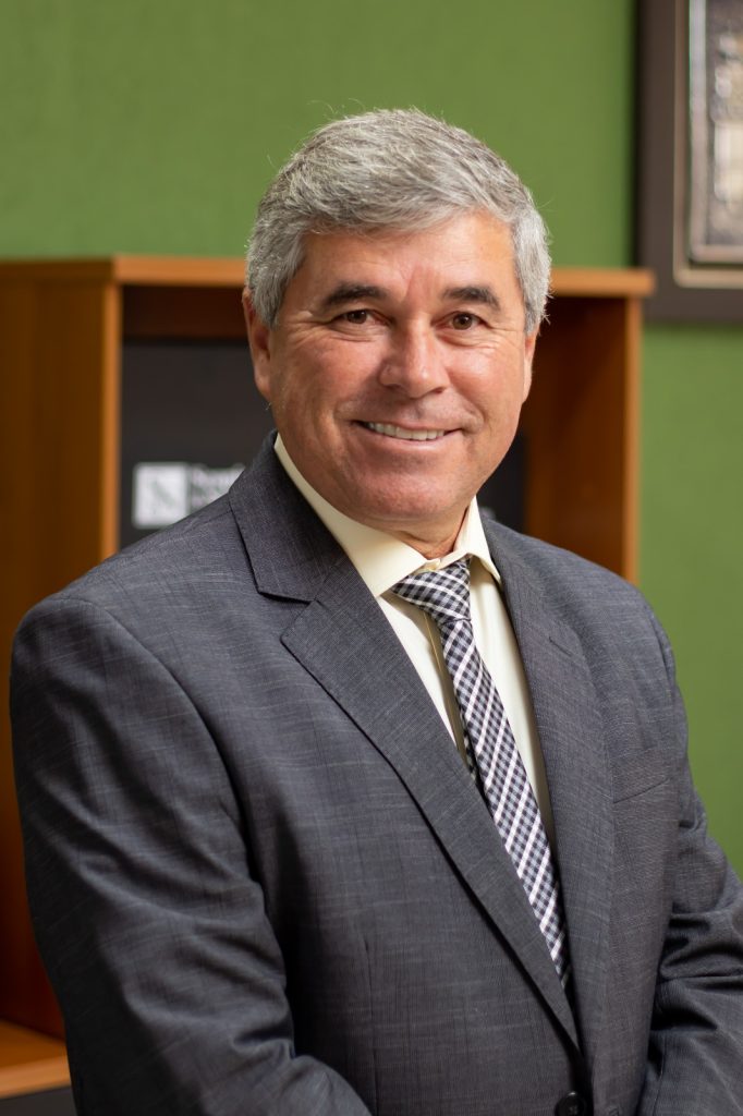 Dr. Carlos E. Scopim